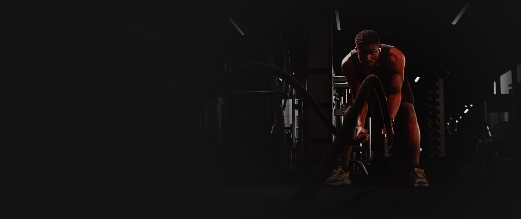 Athlete training with battle ropes